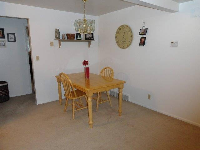 Dining room with table and chairs at Crestview 457 East, unfurnished family housing